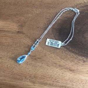 Blue Topaz set in white gold, 18 inches.